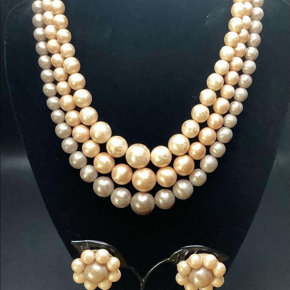 Beautiful 3 Strand Beaded Necklace and clip on Earrings.